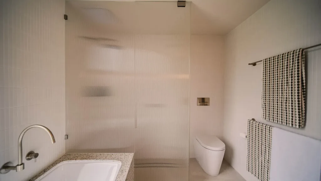 alma custom luxury bathroom with textured glass shower
